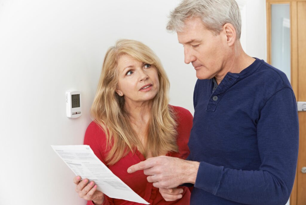 Couple examining their high electrical bill