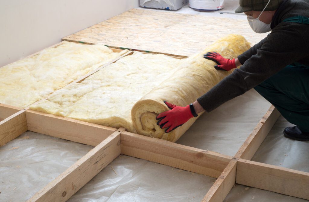 Attic Man replacing floor insulation
